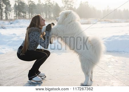 young Figure skating woman with dog Samoyed