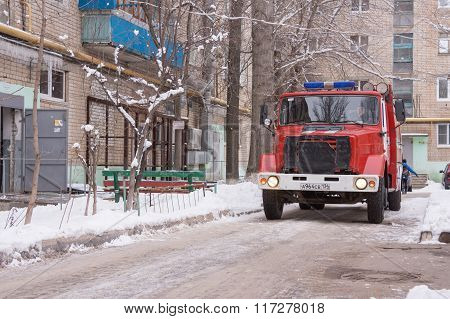 Fire Service Machine Is At The Entrance Of A Block Of Flats