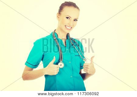 Woman doctor with thumbs up.