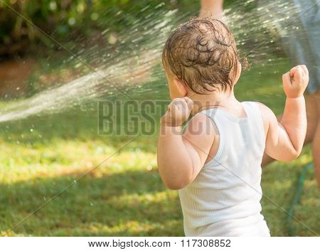 Child playing with water