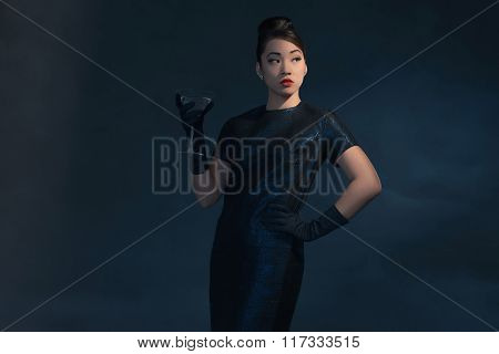 Retro 40S Styled Asian Woman In Evening Dress With Cocktail Glass.