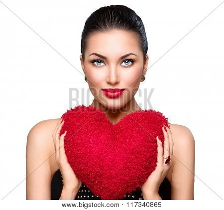 Sexy model Woman portrait. Gorgeous young brunette woman with heart shaped red pillow. Perfect make up. Valentine' Day brunette lady headshot. Valentine, love