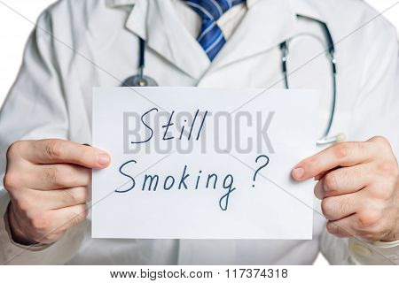 Doctor holds a clipboard with still smoking label