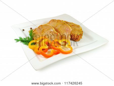 Raw Meat. Pork Escalope Slices With Sause  In A Dish Isolated Against White Background