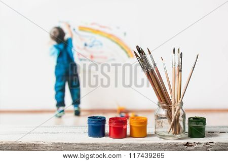 paint and brush in the foreground
