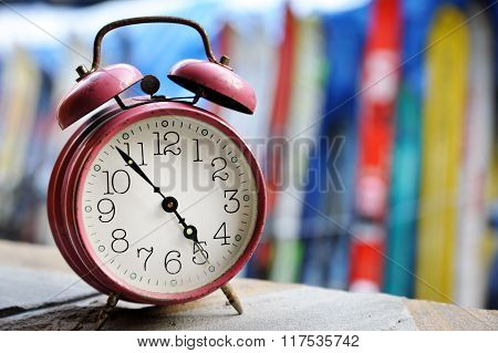 Vintage metal analog alarm clock with Arabic numbers