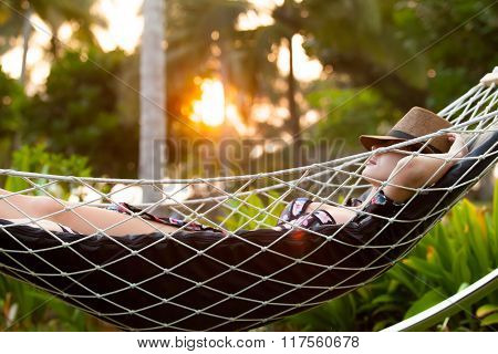 Woman Relaxing In A Hammock