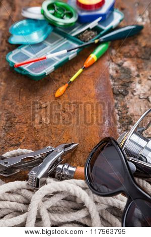 Fishing Tackles For Anglers On Wooden Background