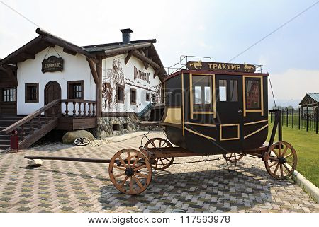 Vintage stagecoach and Restaurant Tavern Dillizhans. Tourist Complex Siberian Podvorye.