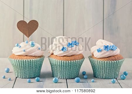 Cupcakes with heart cakepick for text