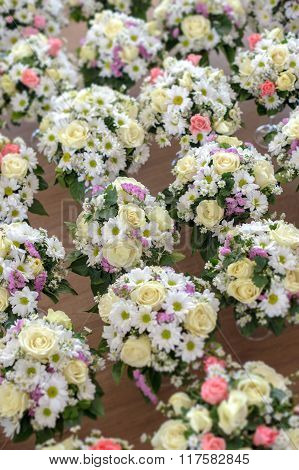 Several Bouquets In Several Glasses Of Champagne