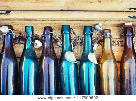 Vintage Bottles on Wooden Background