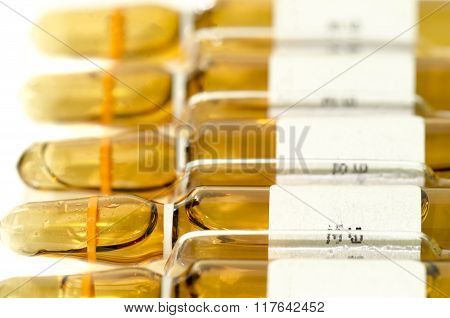 Many Sterile Vial And Ampule Filled With Injection Dosage Form Medication Solution Isolated On White