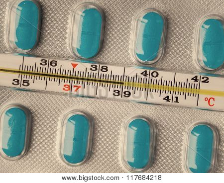 Thermometer and pills