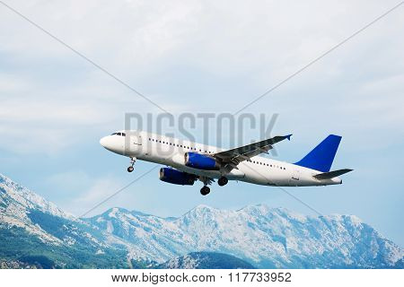 Aircraft take off. Mountains view.