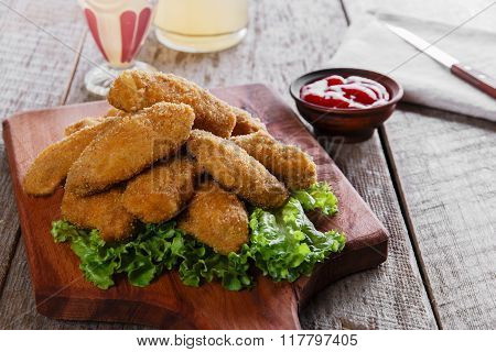 chicken wings fried in breadcrumbs with sauce