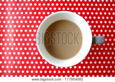 Coffee or tea cup with polka dot background