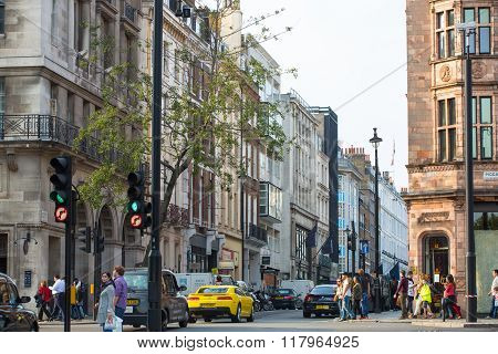Pall Mall street view with cars and people walking by