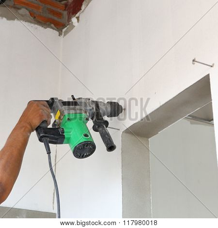 Worker Use Driller For Drill Wall