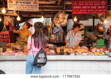 Women are selling meat at the wet market