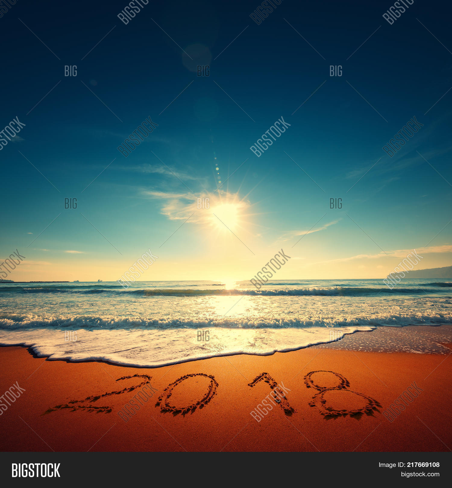 happy new year 2018 concept lettering on the beach. sea sunrise.
