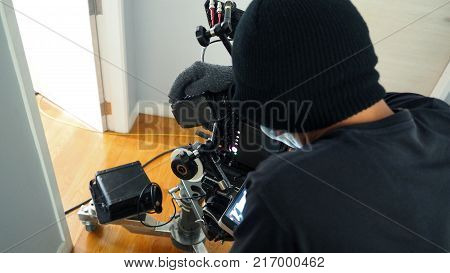 VDO camera shooting for commercial production and camera man with film crew and equipments.