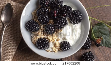Fresh Blackberries Ant Oatmeal Snack On Rustic Table Background