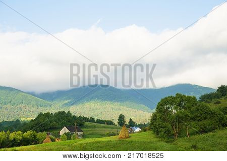 Haystack summer in the beautiful village Ukrainian Carpathians