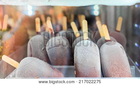 Frozen milk chocolate icecream in the fridge on display on the cafe in Positano town Amalfi coast Italy