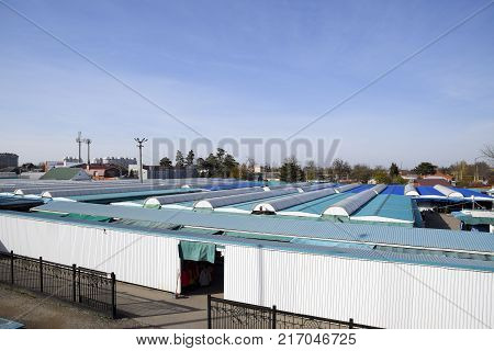 Covered Market In The City. Rows Of Sales Outlets. View From The Bridge To The City Market.