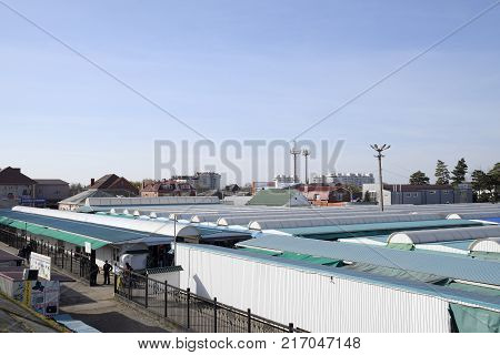 Covered Market In The City. Rows Of Sales Outlets. View From The Bridge To The City Market.