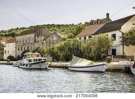 Zlarin Isle with boat and old house Croatia