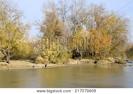Fishermen On The Bank Of The River In Autumn. Fishing The Bait.