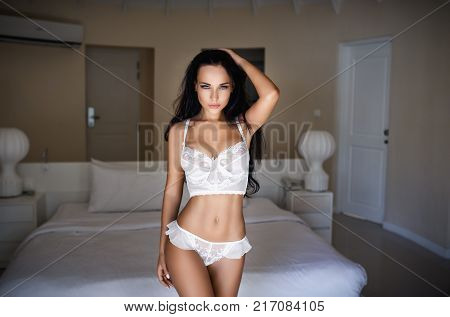Beautiful young girl in a sexy white lingerie