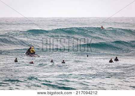 SUNSET BEACH HAWAII USA - DECEMBER 2: Surf patrol staff members filming surfers at the 2017 Vans World Cup of Surfing competition at Sunset Beach on Oahu's scenic North Shore. This is the second of three surfing competitions and Conner Coffin
