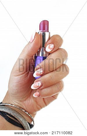 Woman hand holding lipstick on isolated white cutout background. Studio photo with studio lighting easy to use for every concept. Used lipstick.