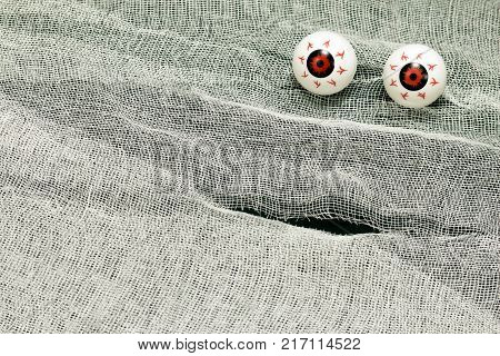 Funny background of a smiling mummy made from bandages for Halloween. Can be used for greeting card, party invitation, poster, flyer, vertical banner.