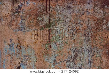 Abstract background of old worn wooden boards of different colors close up