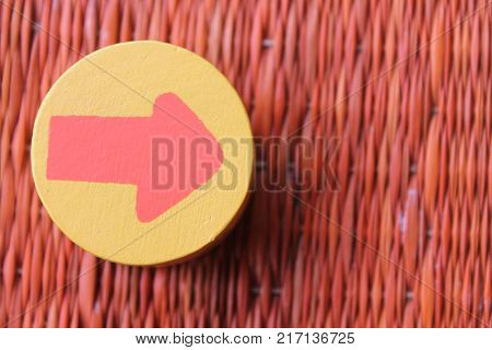 Traditional thai style nature background of brown handicraft weave texture wicker surface for furniture material with red arrow in yellow circle