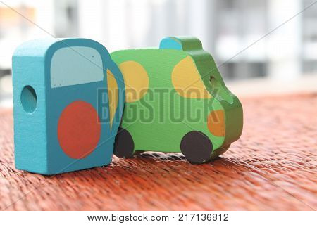 Traditional thai style nature background of brown handicraft weave texture wicker surface for furniture material with green toy car on it