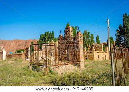 NARYN, KYRGYZSTAN - AUGUST 9: Tombstones in old muslim cemetery Naryn Kyrgyzstan. August 2016