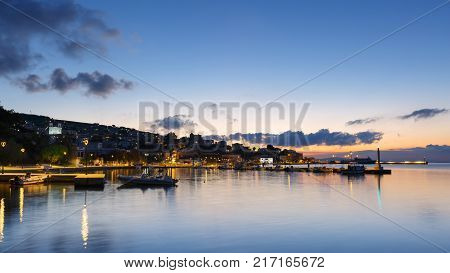 Early morning view of the harbour on Inouses island in Greece.