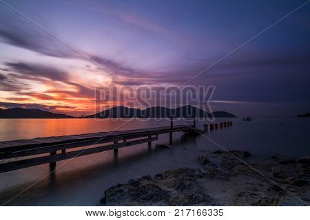 Beautiful view of sunset at Lumut,Perak,Malaysia. Soft focus,motion blur due to Long Exposure.Visible noise due to High ISO.