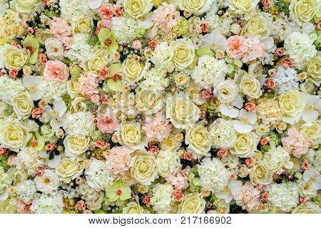 Beautiful artificial flowers background for wedding scene free space. Floral background copy space view from above. Holiday greeting card for Valentine's Day Woman's Day (March 8) Mother's Day