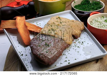 Roasted meat with rice, farofa and kale