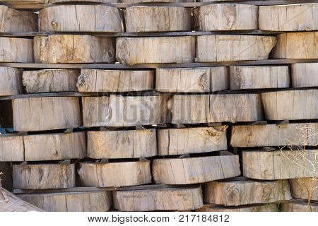 Wood Background Texture. Cross Section Of Tree Trunk. Spili Trees Stumps Stacked In Stacks. Used For