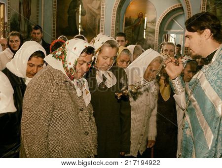 VOYUTYN UKRAINE - 14 October 2008: Priest holding smoking incense during the religious celebration Pokrov