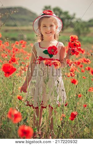 Cute Blond Young Girl Child Stylish Dressed In White Handmade Hooked Dress Wearing Airy Hat Top Posi