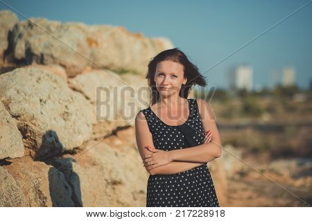 Hot Sexy Stylish Dressed Young Lady Brunette Hairs And Pinky Cheeks With Open Legs Shoulders And Arm