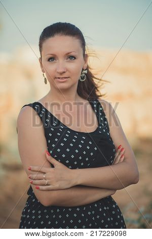 Hot Sexy Stylish Dressed Young Lady Brunette Hairs And Pinky Cheeks With Open Legs Shoulders And Arm